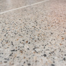 Luxury Vinyl Tile in Polished Concrete with Light Grey Grout